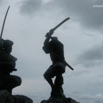 Famed swordsmen Sasaki Kojirō (left) and Miyamoto Musashi duel it out for all eternity on Ganryū Island (June 2010)